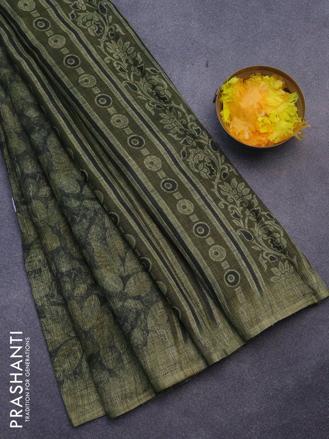 Jute cotton saree dark sap green and mehendi green with allover leaf prints and simple border