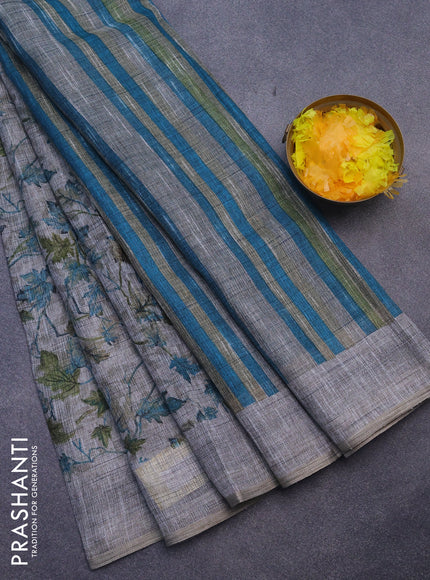 Jute cotton saree grey and blue with allover leaf prints and simple border