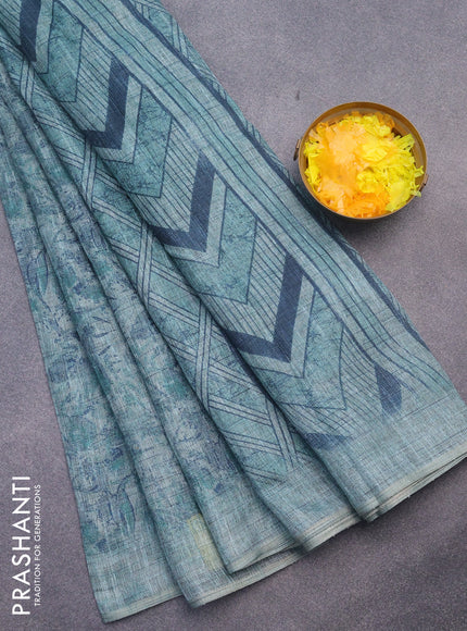 Jute cotton saree teal green shade with allover floral prints and simple border