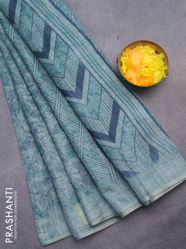 Jute cotton saree teal green shade with allover floral prints and simple border