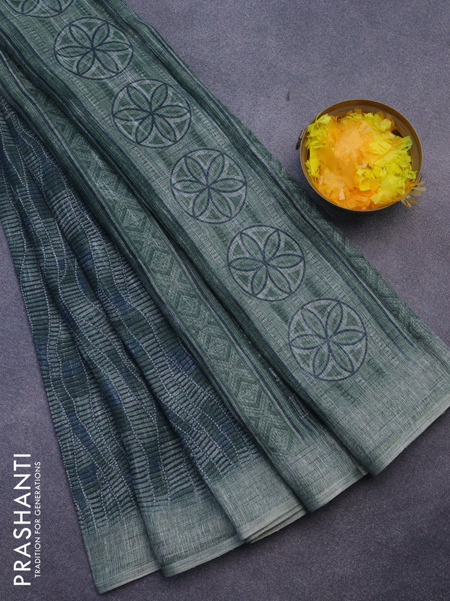 Jute cotton saree sap green with allover prints and simple border