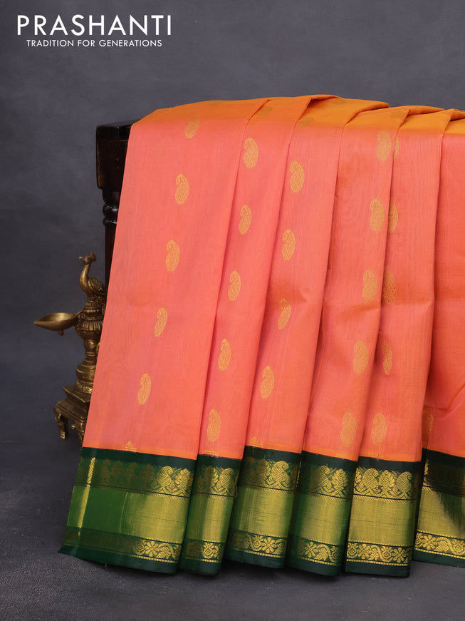 Kuppadam silk cotton saree dual shade of peach orange and dark green with paisley zari woven buttas and rich zari woven border