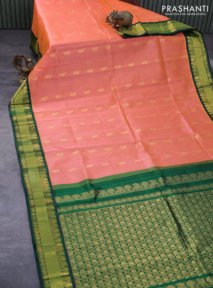 Kuppadam silk cotton saree dual shade of peach orange and dark green with paisley zari woven buttas and rich zari woven border