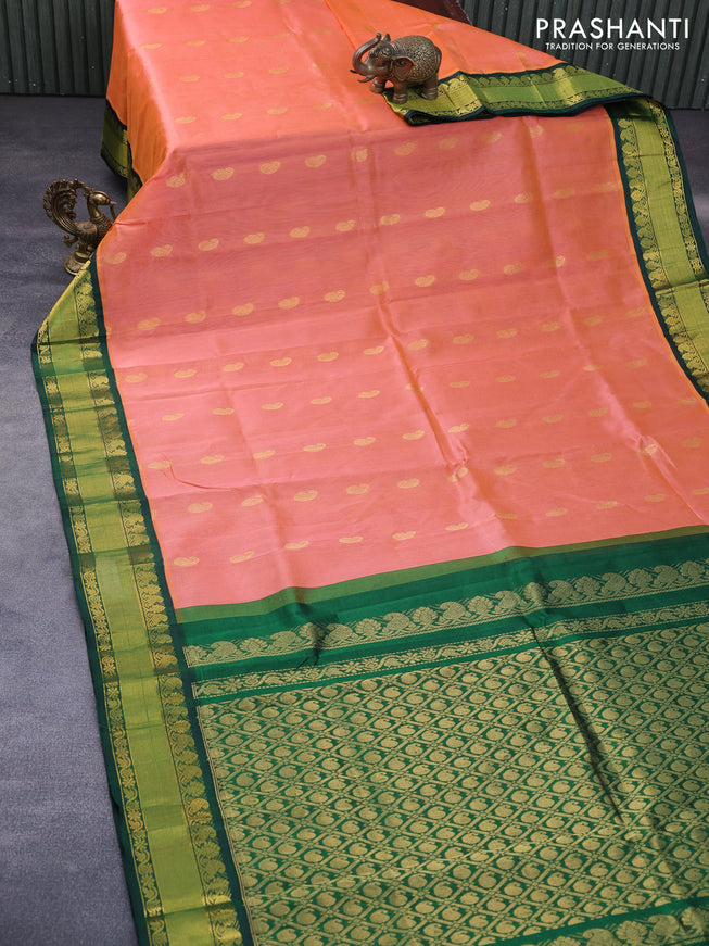 Kuppadam silk cotton saree dual shade of peach orange and dark green with paisley zari woven buttas and rich zari woven border