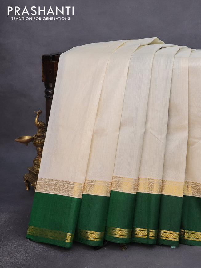 Kuppadam silk cotton saree off white and dark green with plain body and rettapet zari woven border