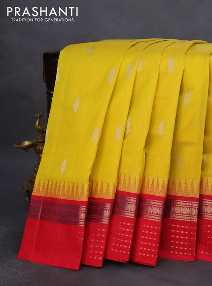 Kuppadam silk cotton saree yellow and red with silver zari woven buttas and temple design zari woven border