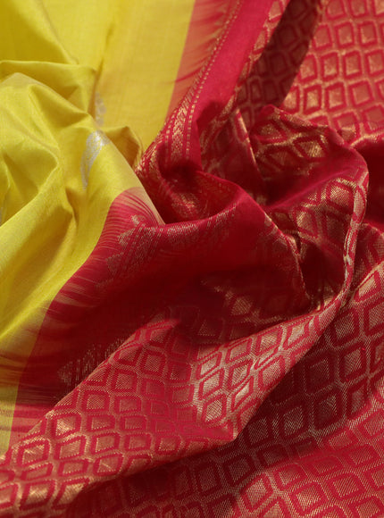 Kuppadam silk cotton saree yellow and red with silver zari woven buttas and temple design zari woven border