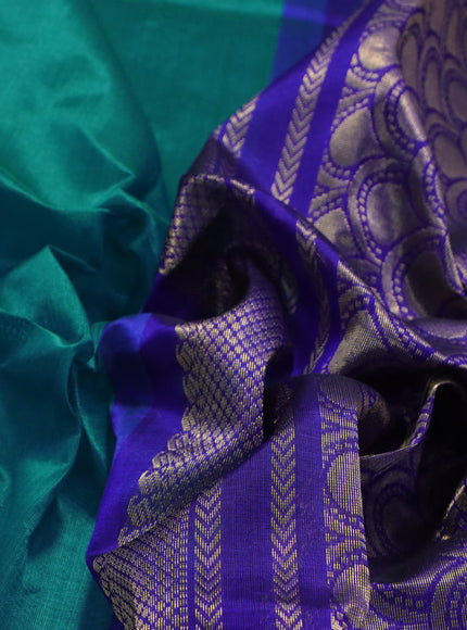 Kuppadam silk cotton saree teal blue and blue with plain body and zari woven korvai border