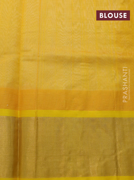 Kuppadam silk cotton saree off white and yellow with plain body and temple design zari woven border