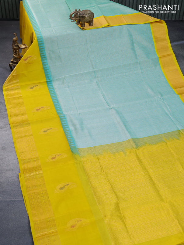 Kuppadam silk cotton saree teal green shade and yellow with allover checked pattern and temple design paisley zari woven butta border