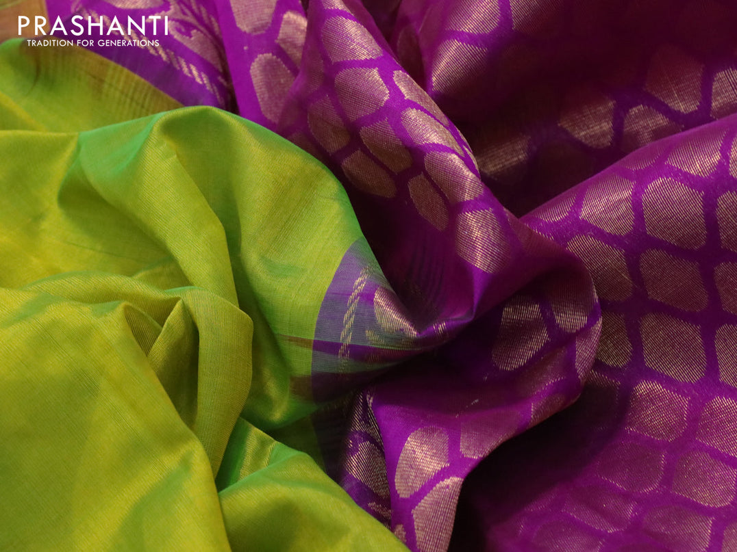 Kuppadam silk cotton saree dual shade of light green and purple with plain body and temple design zari woven border