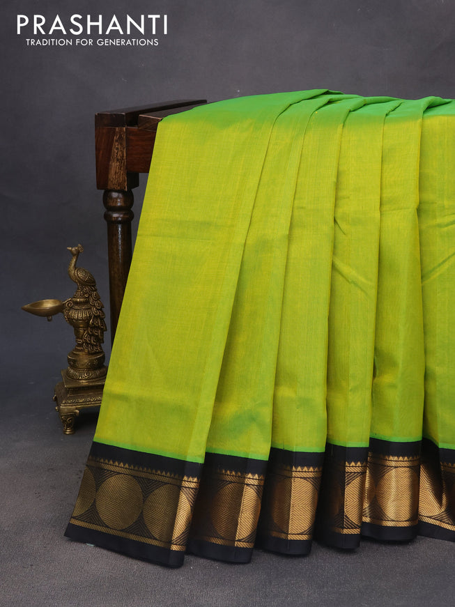 Silk cotton saree light green and black with plain body and rudhraksha zari woven korvai border