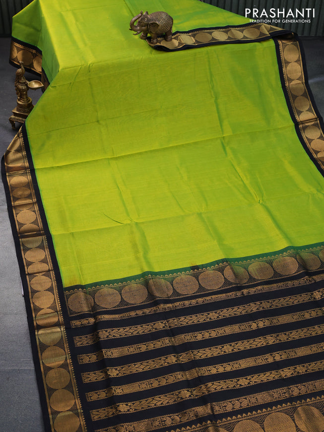 Silk cotton saree light green and black with plain body and rudhraksha zari woven korvai border