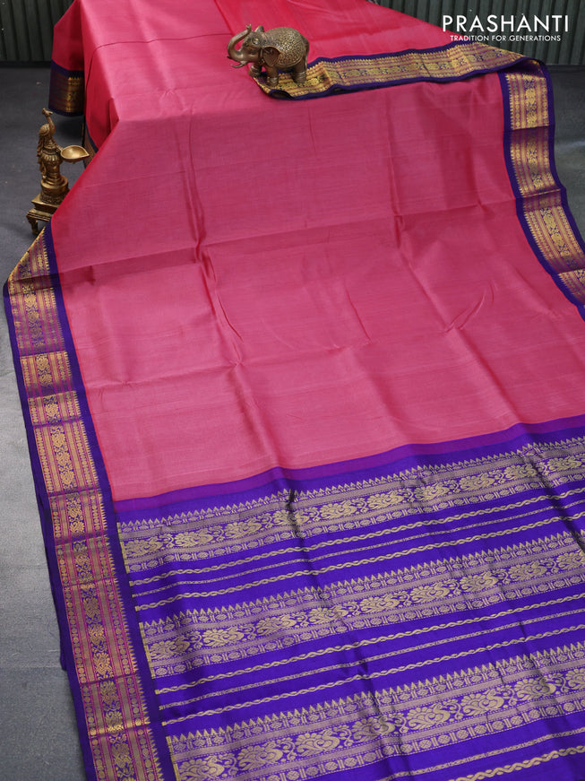 Silk cotton saree pink shade and blue with plain body and zari woven korvai border