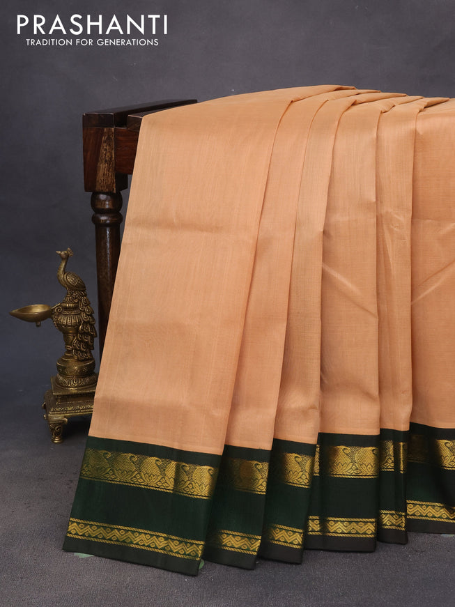 Silk cotton saree sandal and bottle green with plain body and rettapet zari woven korvai border