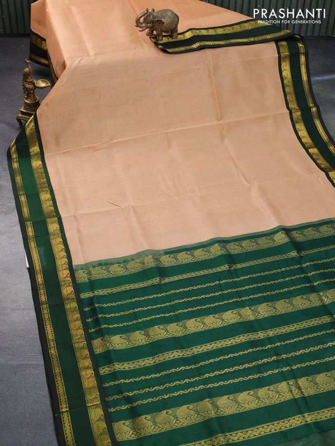 Silk cotton saree sandal and bottle green with plain body and rettapet zari woven korvai border