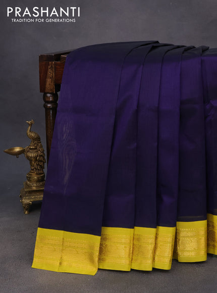 Silk cotton saree dark blue and lime yellow with plain body and zari woven korvai border