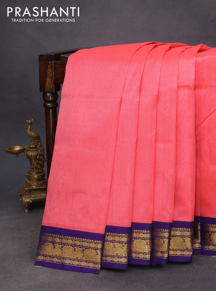 Silk cotton saree peach pink and blue with plain body and zari woven korvai border