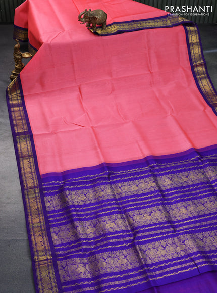 Silk cotton saree peach pink and blue with plain body and zari woven korvai border