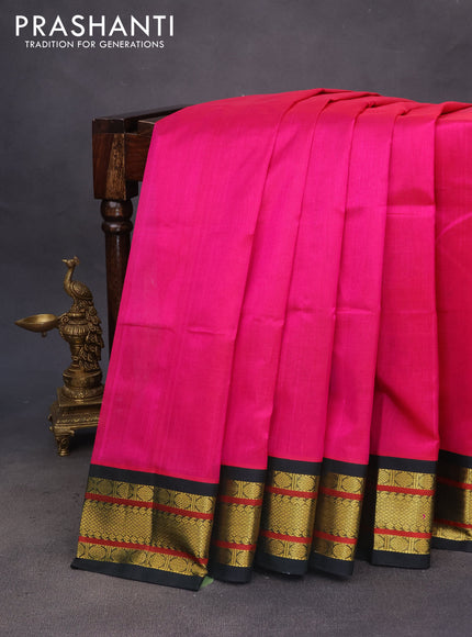 Silk cotton saree pink shade and bottle green with plain body and zari woven korvai border