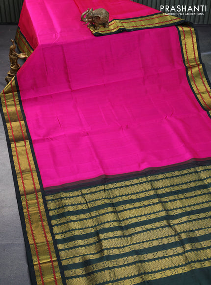 Silk cotton saree pink shade and bottle green with plain body and zari woven korvai border