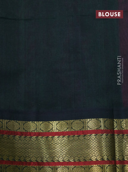 Silk cotton saree pink shade and bottle green with plain body and zari woven korvai border