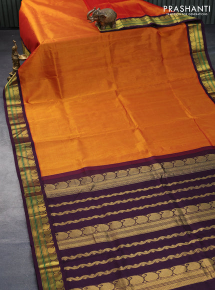 Silk cotton saree rustic orange and wine shade with plain body and paisley zari woven border