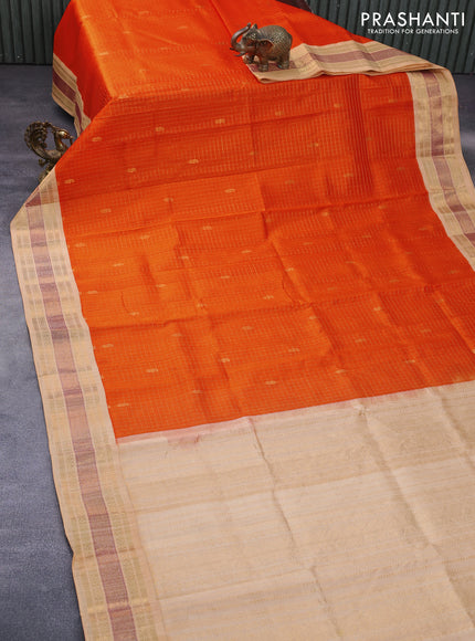 Silk cotton saree orange and sandal with allover zari checks & buttas and zari woven korvai border