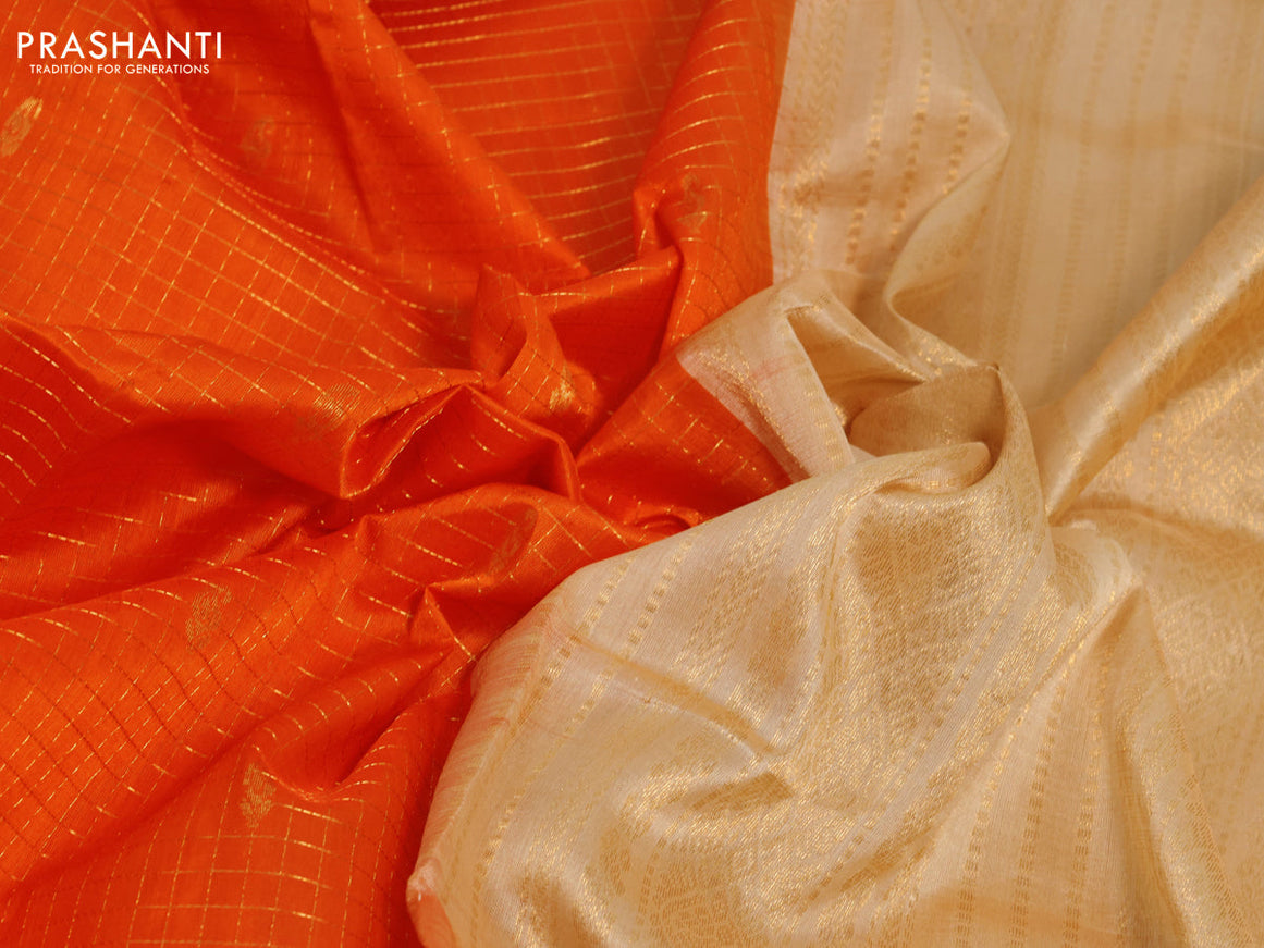 Silk cotton saree orange and sandal with allover zari checks & buttas and zari woven korvai border