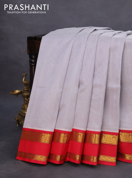 Silk cotton saree pastel grey and red with plain body and rettapet zari woven korvai border