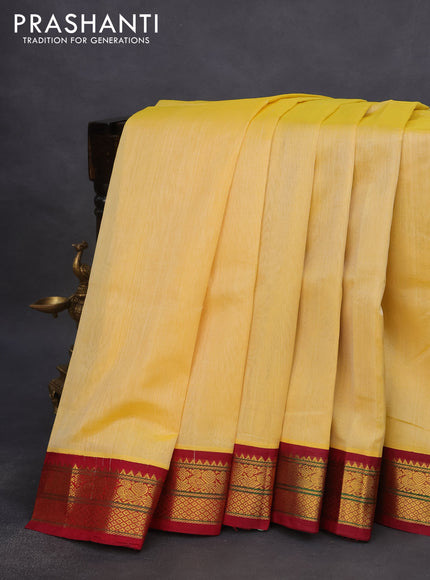 Silk cotton saree pale yellow and maroon with plain body and zari woven korvai border