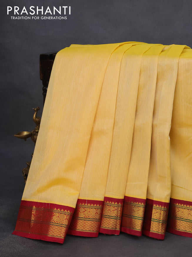 Silk cotton saree pale yellow and maroon with plain body and zari woven korvai border