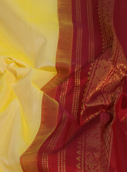 Silk cotton saree pale yellow and maroon with plain body and zari woven korvai border