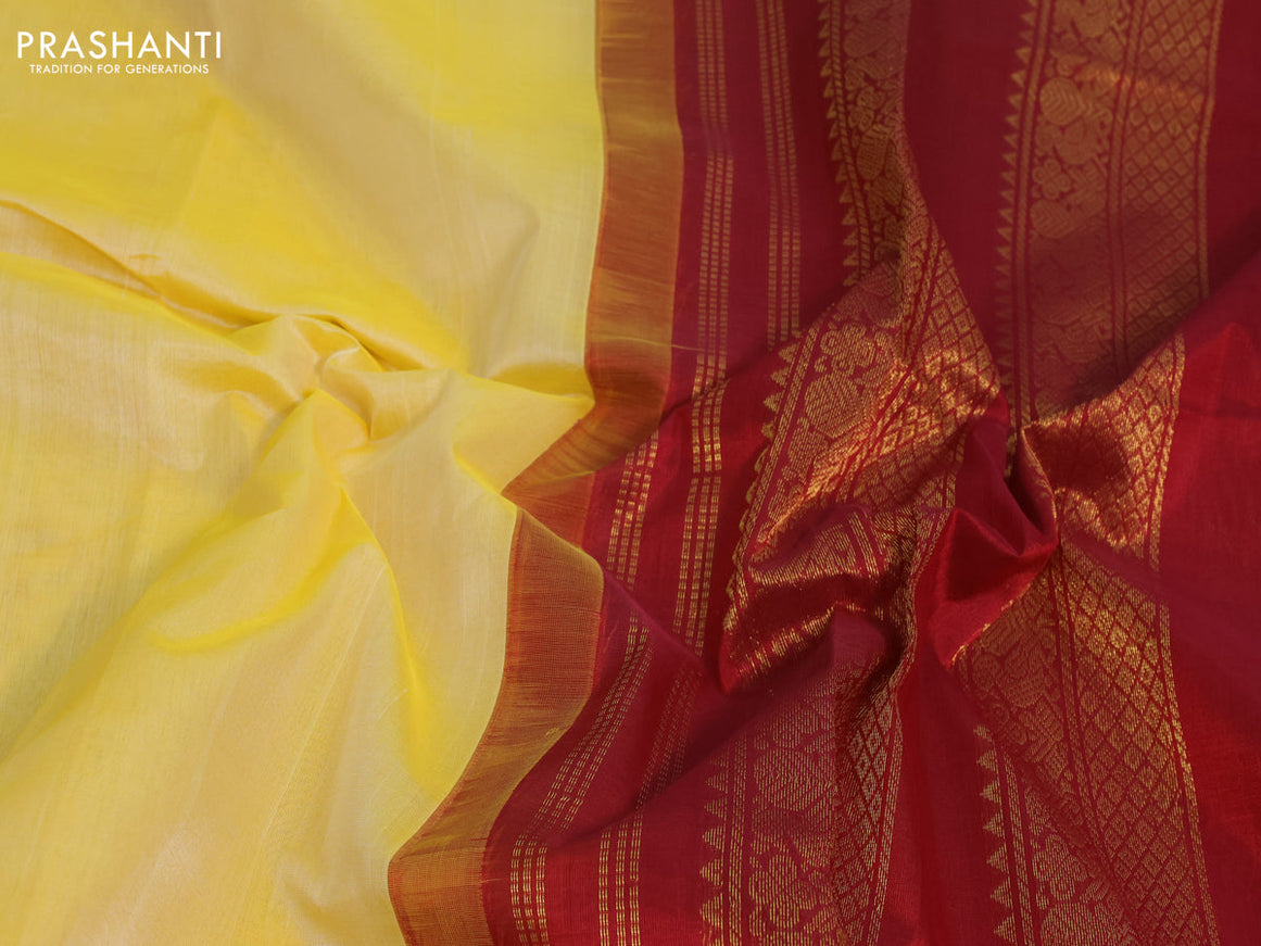 Silk cotton saree pale yellow and maroon with plain body and zari woven korvai border