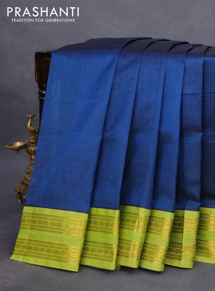 Silk cotton saree peacock blue and light green with plain body and rettapet zari woven korvai border