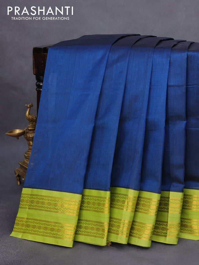 Silk cotton saree peacock blue and light green with plain body and rettapet zari woven korvai border