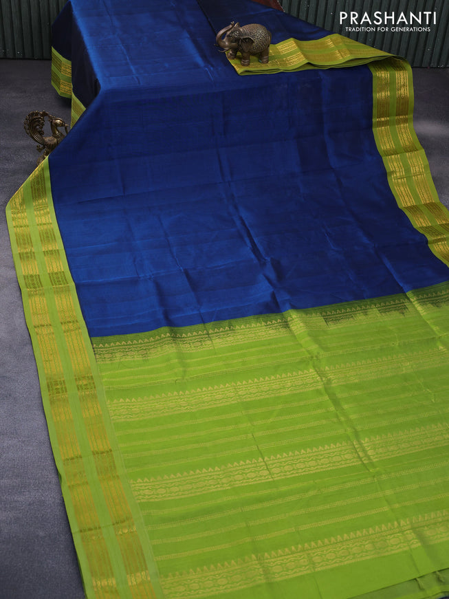 Silk cotton saree peacock blue and light green with plain body and rettapet zari woven korvai border