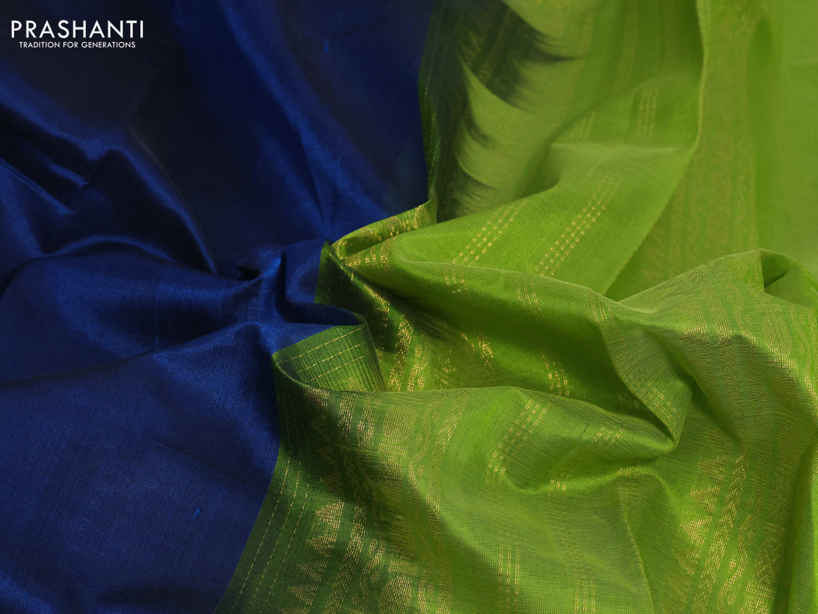 Silk cotton saree peacock blue and light green with plain body and rettapet zari woven korvai border