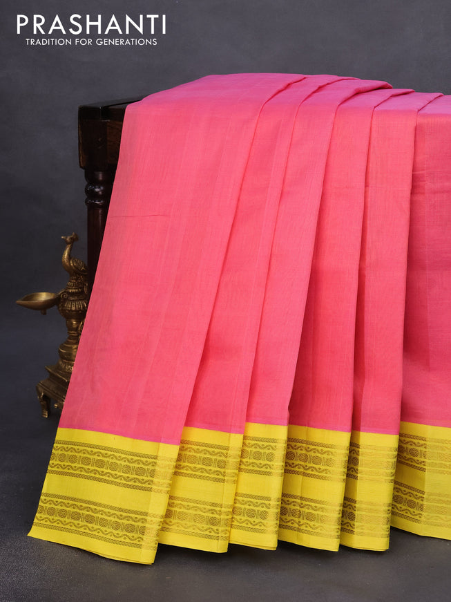 Silk cotton saree peach pink and yellow with plain body and rettapet zari woven korvai border