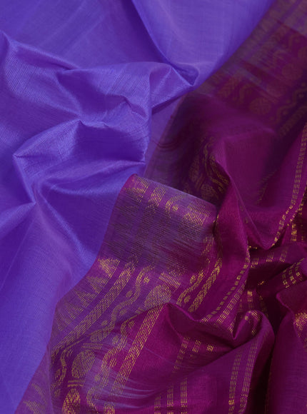 Silk cotton saree lavender shade and purple with plain body and rettapet zari woven korvai border