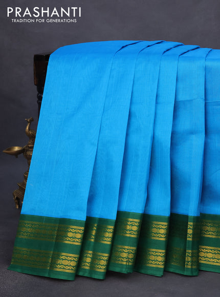 Silk cotton saree blue and green with plain body and rettapet zari woven korvai border