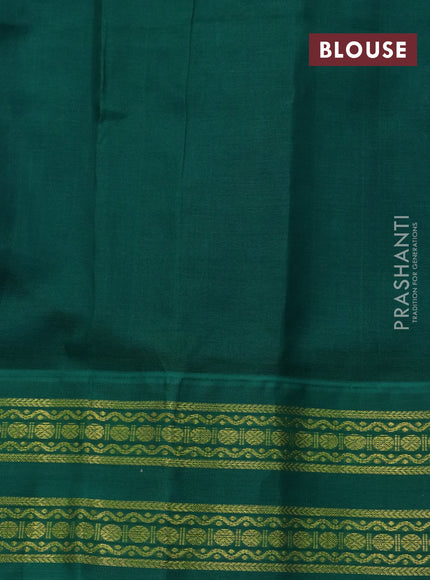 Silk cotton saree blue and green with plain body and rettapet zari woven korvai border