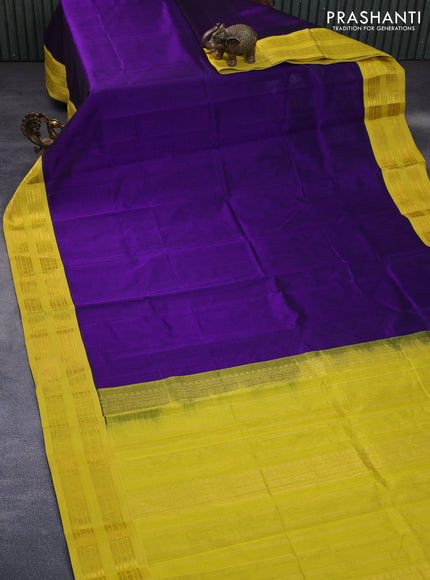 Silk cotton saree deep violet and yellow with plain body and rettapet zari woven korvai border