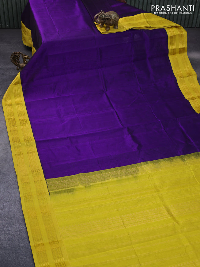 Silk cotton saree deep violet and yellow with plain body and rettapet zari woven korvai border