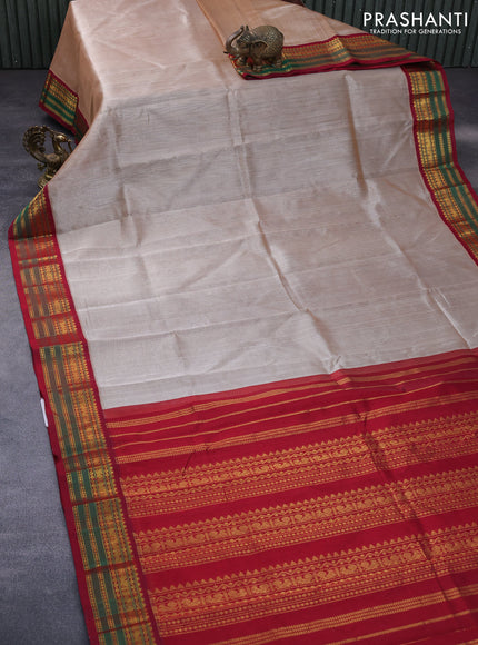 Silk cotton saree beige and maroon with plain body and zari woven korvai border