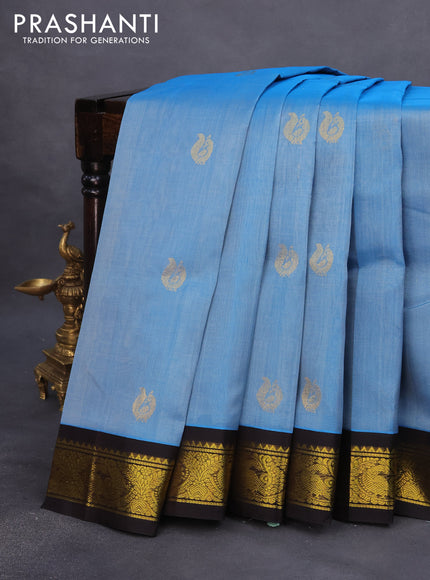 Silk cotton saree blue and dark coffee brown with annam zari woven buttas and zari woven korvai border