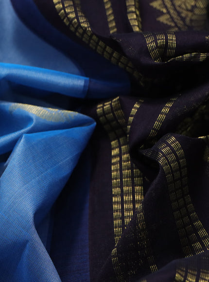 Silk cotton saree blue and dark coffee brown with annam zari woven buttas and zari woven korvai border