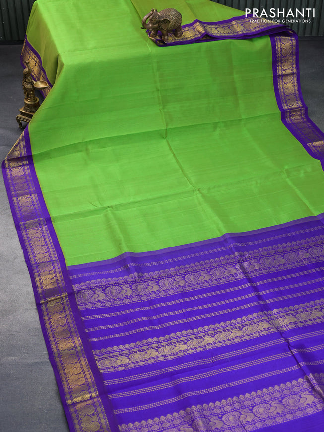 Silk cotton saree light green and violet with plain body and annam zari woven korvai border