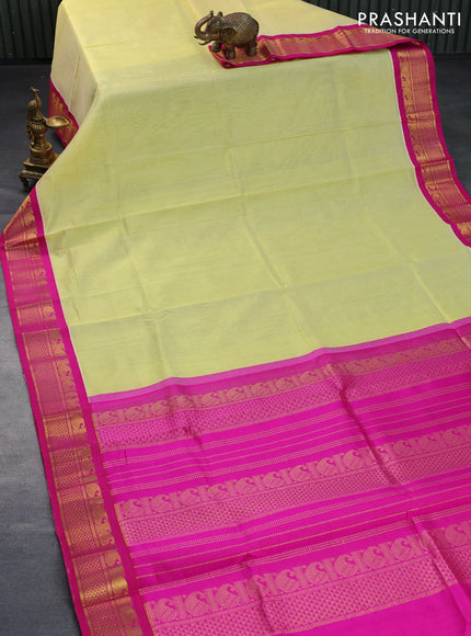 Silk cotton saree pale yellow and pink with plain body and zari woven korvai border