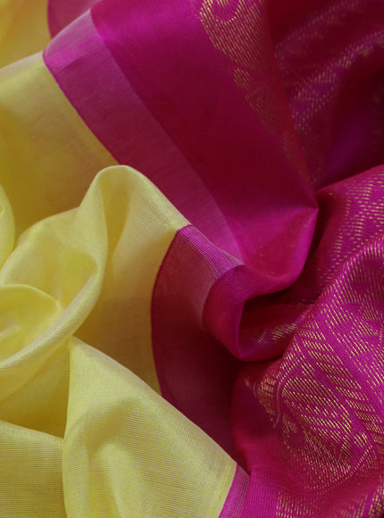 Silk cotton saree pale yellow and pink with plain body and zari woven korvai border